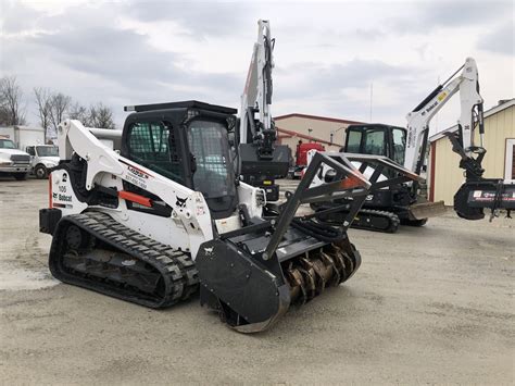 bobcat tracked skid steer with deforester attachment rental near me|bobcat dealers near me.